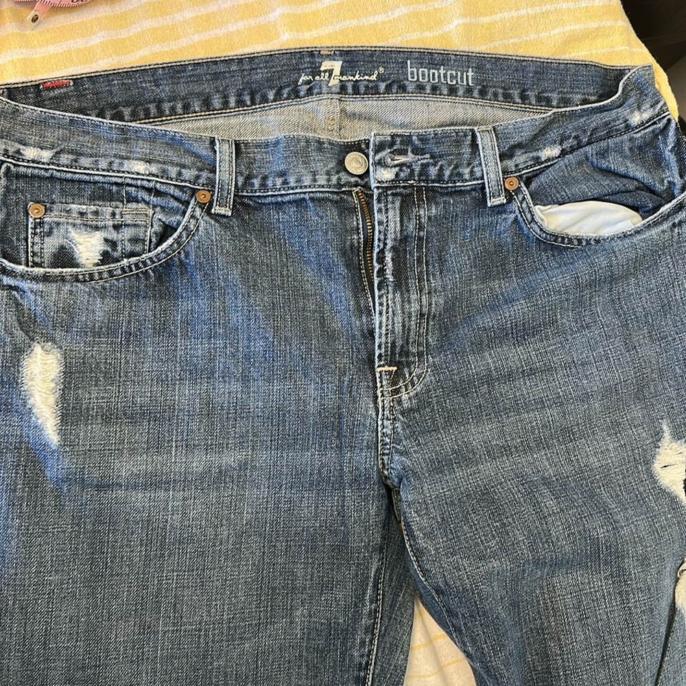 Men’s distressed boot cut jeans